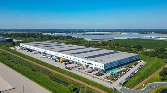 Aerial view of vast industrial complex with a row of truck bays