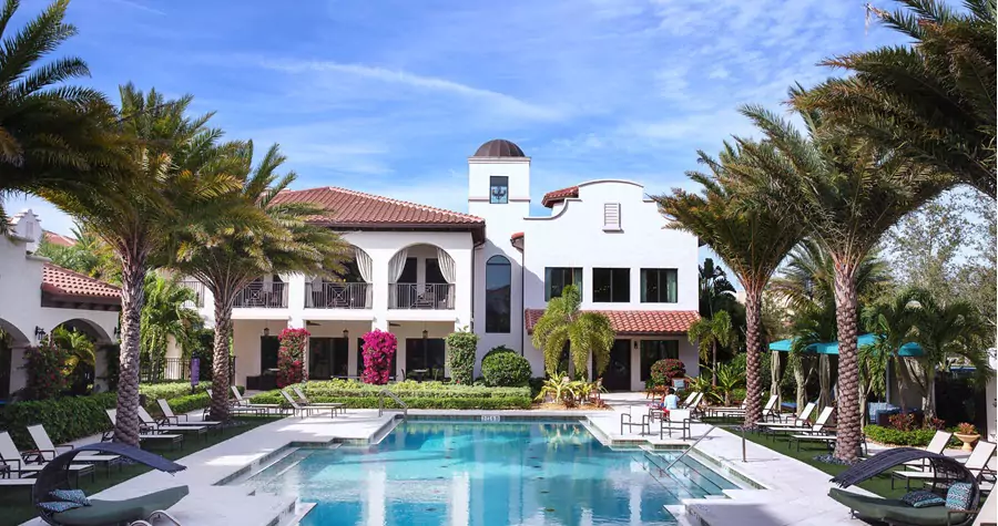 Del Ola Boca apartment swimming pool with palm trees