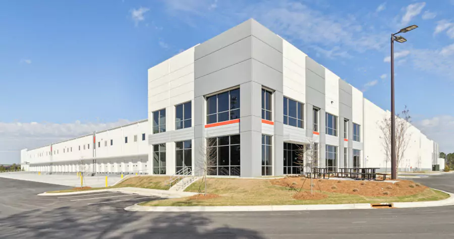 Grey and white industrial warehouse with large windows