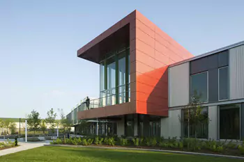 Corner of LINX building featuring 2-story red exterior