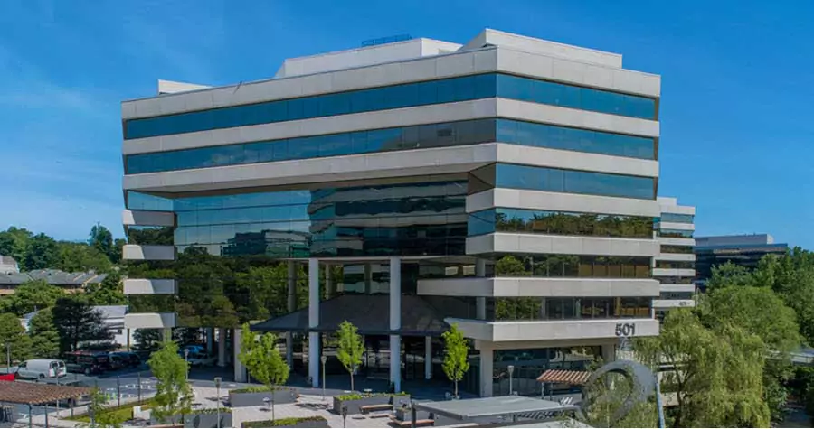 Seven-story Merritt 7 office building with blue sky